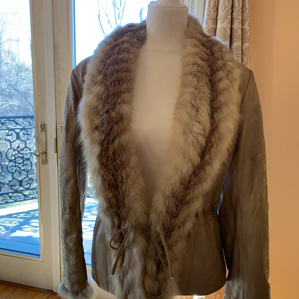 Leather jacket with gold appliqué and a rabbit fur